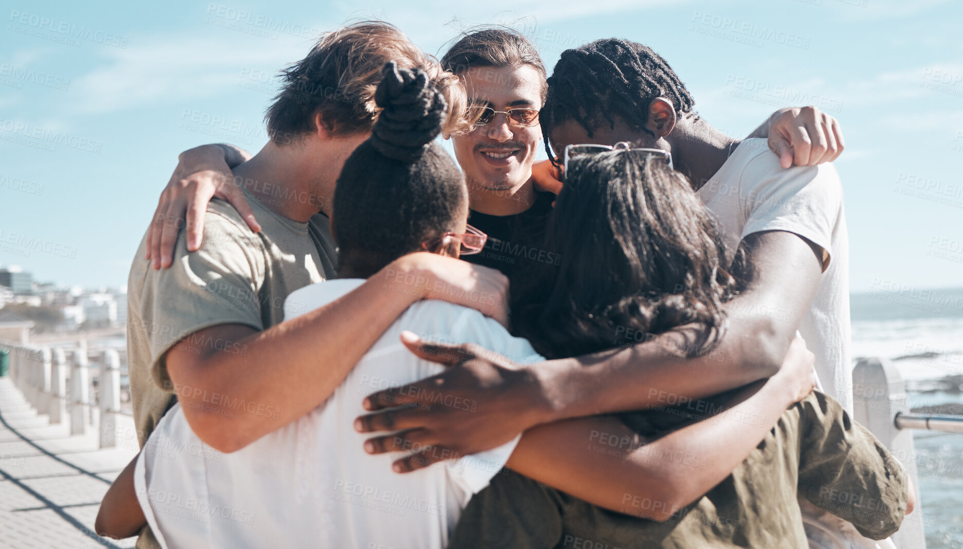 Buy stock photo Bonding friends, huddle or diversity by beach in solidarity travel, community support or group social gathering. Smile, happy men or women circle embrace, summer holiday vacation or global trust hug