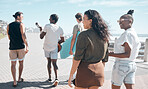 Diversity, walk and friends on beach promenade while on summer vacation or weekend trip together. Friendship, multiracial and group of people people walking, bonding and talking by ocean on holiday.