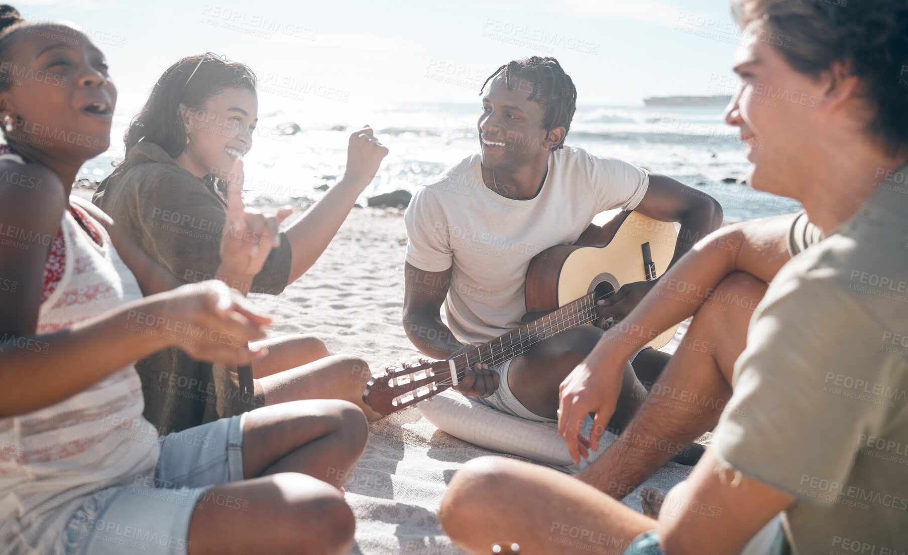 Buy stock photo Couple of friends, dancing or guitar by beach, ocean or sea in holiday vacation, summer travel or social gathering. Dance, happy and bonding diversity people with musical instrument in relax picnic