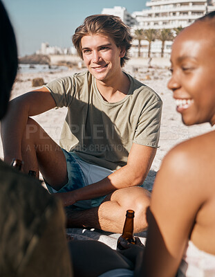 Buy stock photo Man, black woman or friends bonding on beach sand and beer, alcohol drink or cider in holiday, vacation or summer travel. Smile, happy or diversity people by sea in community party or relax freedom