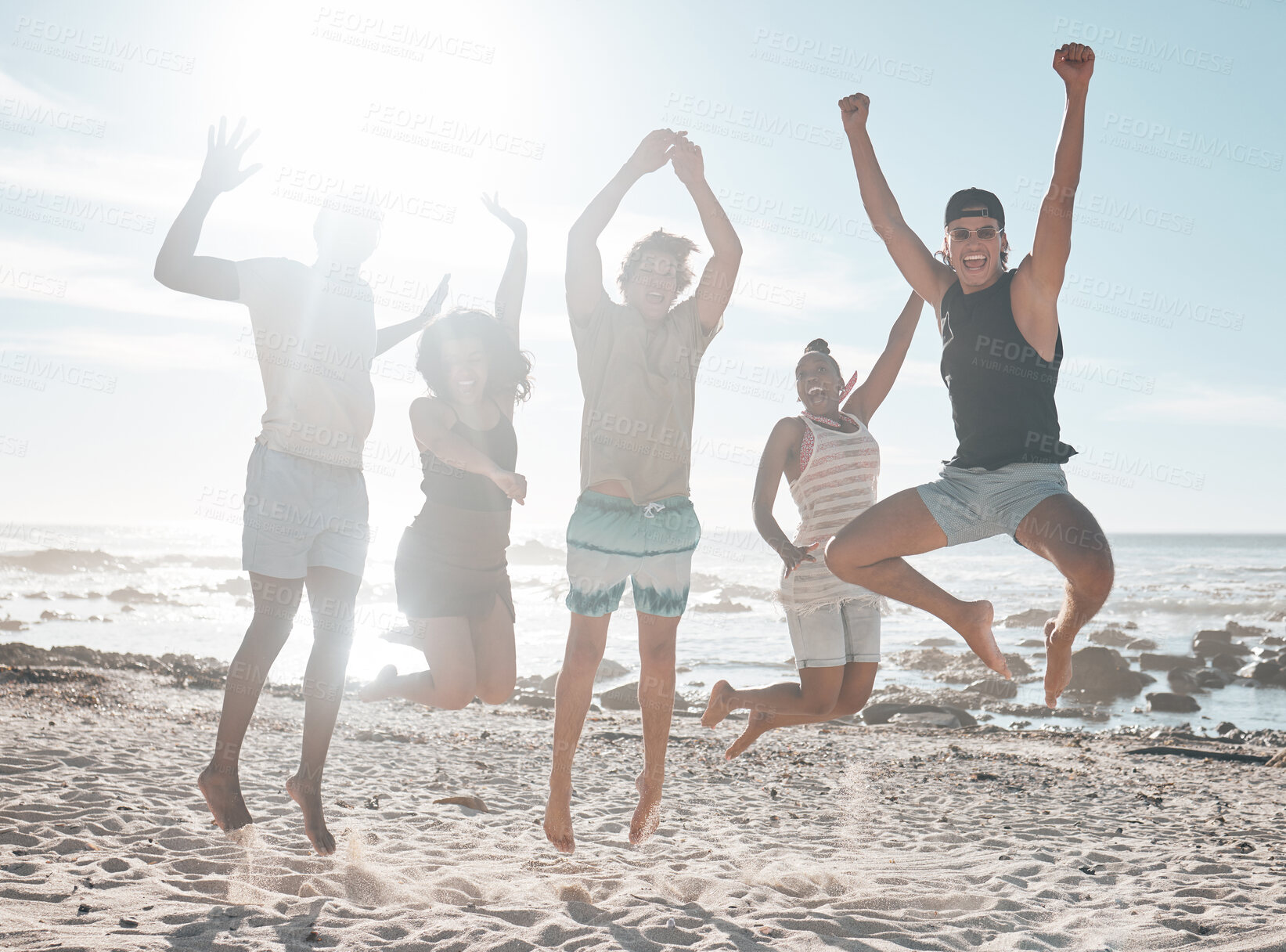 Buy stock photo Friends group, jump and diversity at ocean with bonding, love or funny time with black man, women and happy. Young students vacation, spring break and summer sunshine for reunion, excited or exercise