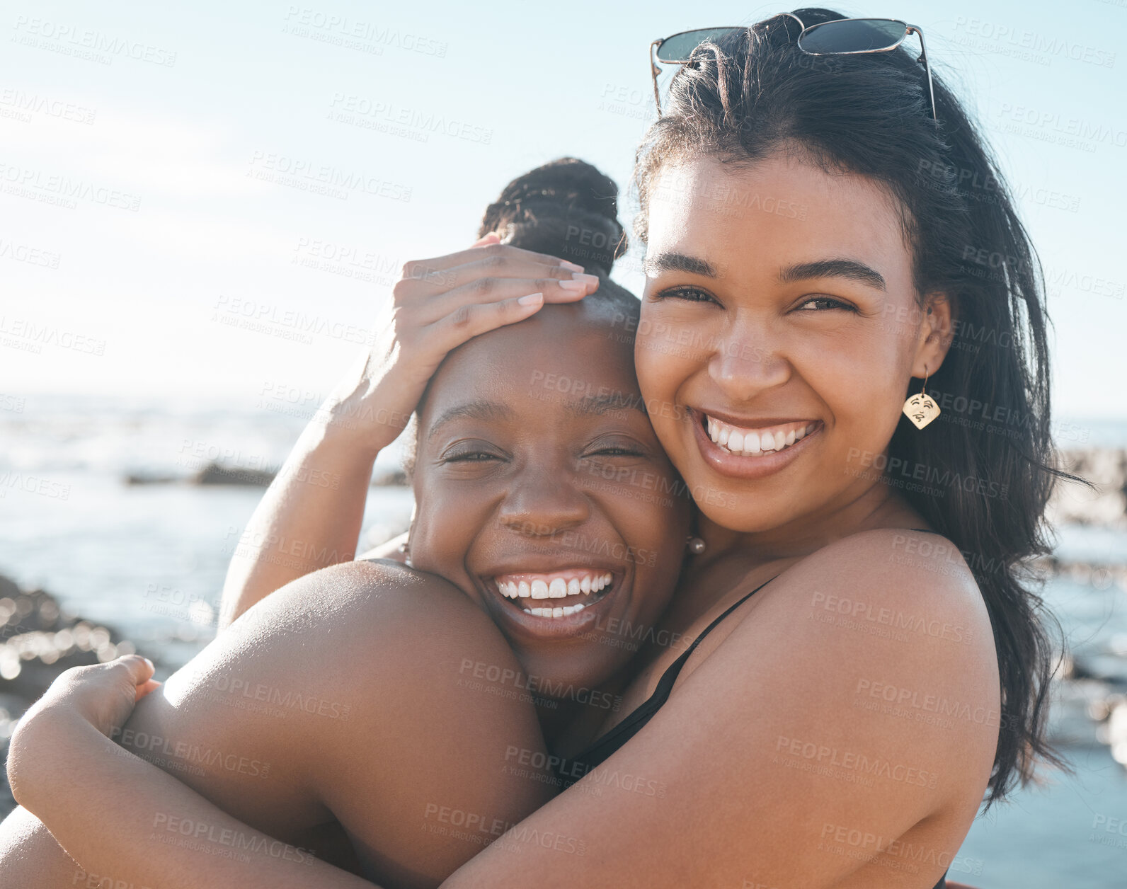 Buy stock photo Women, portrait or friends hug by beach, sea or ocean in summer holiday bonding, support vacation or girls travel location. Smile, happy or black people in embrace, social gathering or relax nature