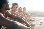 Beach, diversity and friends on a vacation bonding, talking and sitting together on the sand. Happy, travel and multiracial people speaking while on a summer holiday adventure by the sea or ocean.