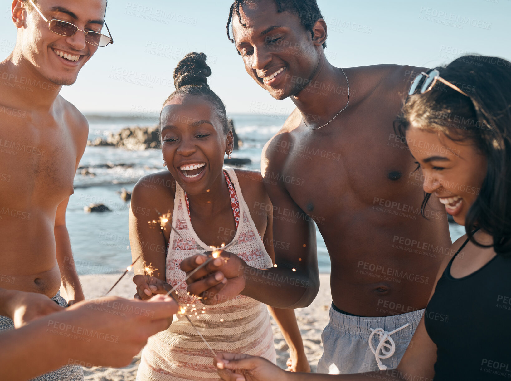 Buy stock photo People, laughing and sparkler in beach celebration, party event or birthday social gathering. Fireworks, sparkle or fun for happy, smile or diversity or friends in new year bonding or holiday travel