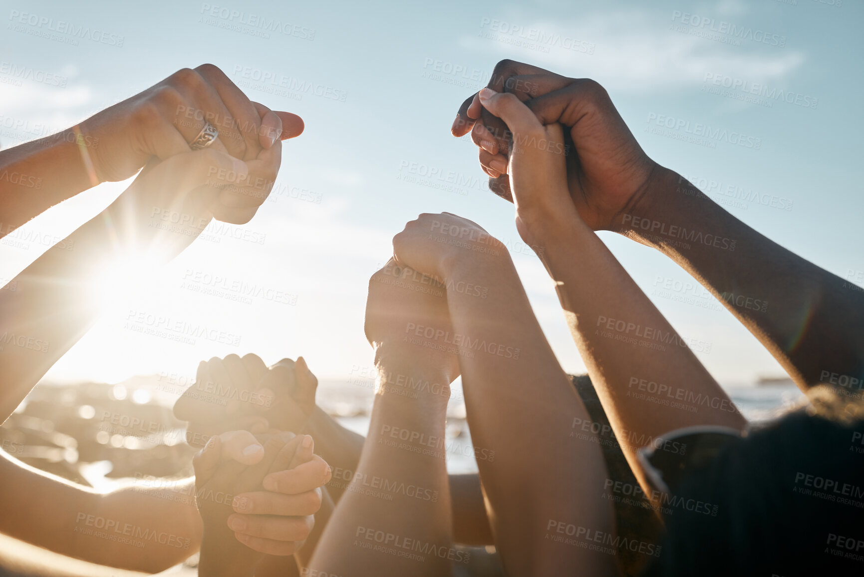 Buy stock photo Friends, bonding and holding hands on beach social gathering, community trust support or summer holiday success. Men, women and diversity people in solidarity, team building or travel mission goals