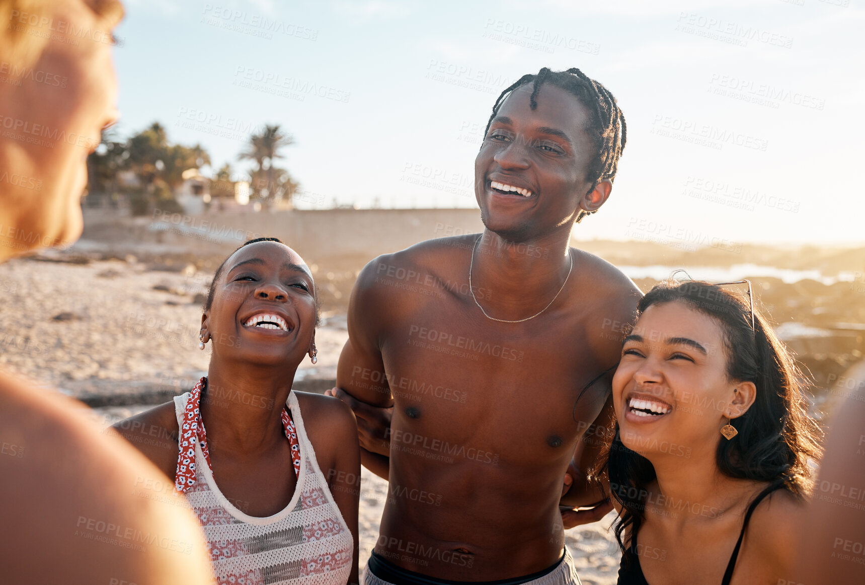 Buy stock photo Friends, laughing or bonding on sunset beach in joke, social gathering comedy or comic group vacation for summer holiday. Smile, happy women or diversity people, travel swimsuit or funny storytelling