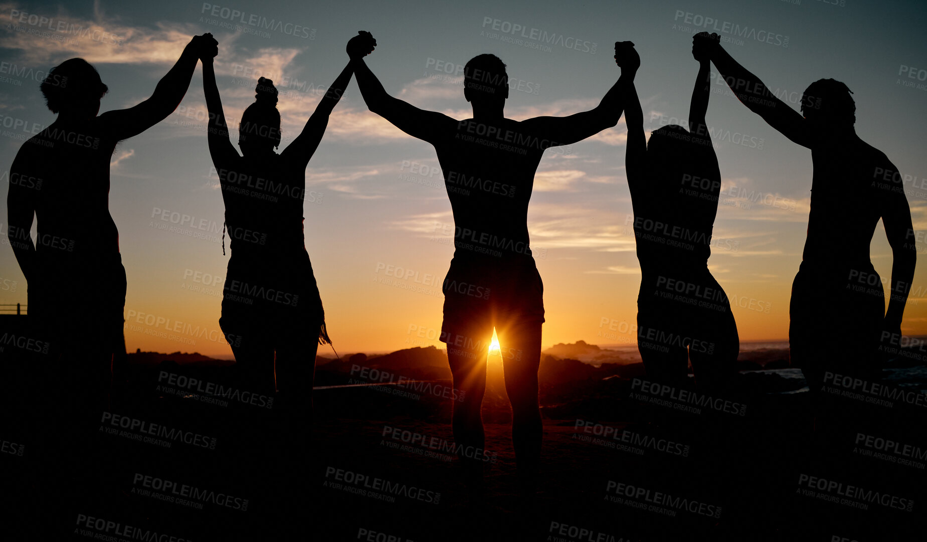 Buy stock photo Friends, celebration and holding hands on sunset beach silhouette, nature freedom or community trust support. Men, women and people sunrise shadow in solidarity, team building or travel bonding goals