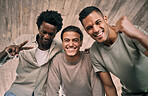 Portrait, peace and wow with man friends standing outdoor together in celebration from below closeup. Happy, smile or city with a group of people cheering while bonding outside on an urban background