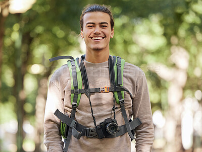 Buy stock photo Hiking photographer, portrait and man in forest for backpack adventure, research or excited trekking journey. Hiker, young person or nature journalist vision for photography, creative and tourism