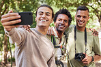 Friends take selfie, hiking and outdoor in nature, men with phone, camera and happy trekking in woods. Social media, post and travel with fitness and group, smile in picture and trust on adventure