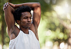 Exercise, fitness and black man stretching arms in nature to start training workout outdoors. Sports, thinking and male athlete stretch, warm up or getting ready for running, exercising or jogging.