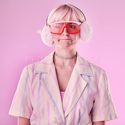 Buy stock photo Fashion, gen z and woman in a studio with trendy glasses, earmuffs and outfit with style. Edgy, beauty and female model with cool clothes and a confused face expression isolated by a pink background.