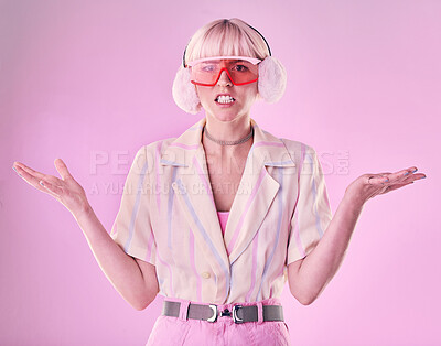 Buy stock photo Confused, angry and portrait of a woman with fashion isolated on a pink background in a studio. Anxiety, sad and stylish girl model wearing ear muffs while frustrated with anger and a problem
