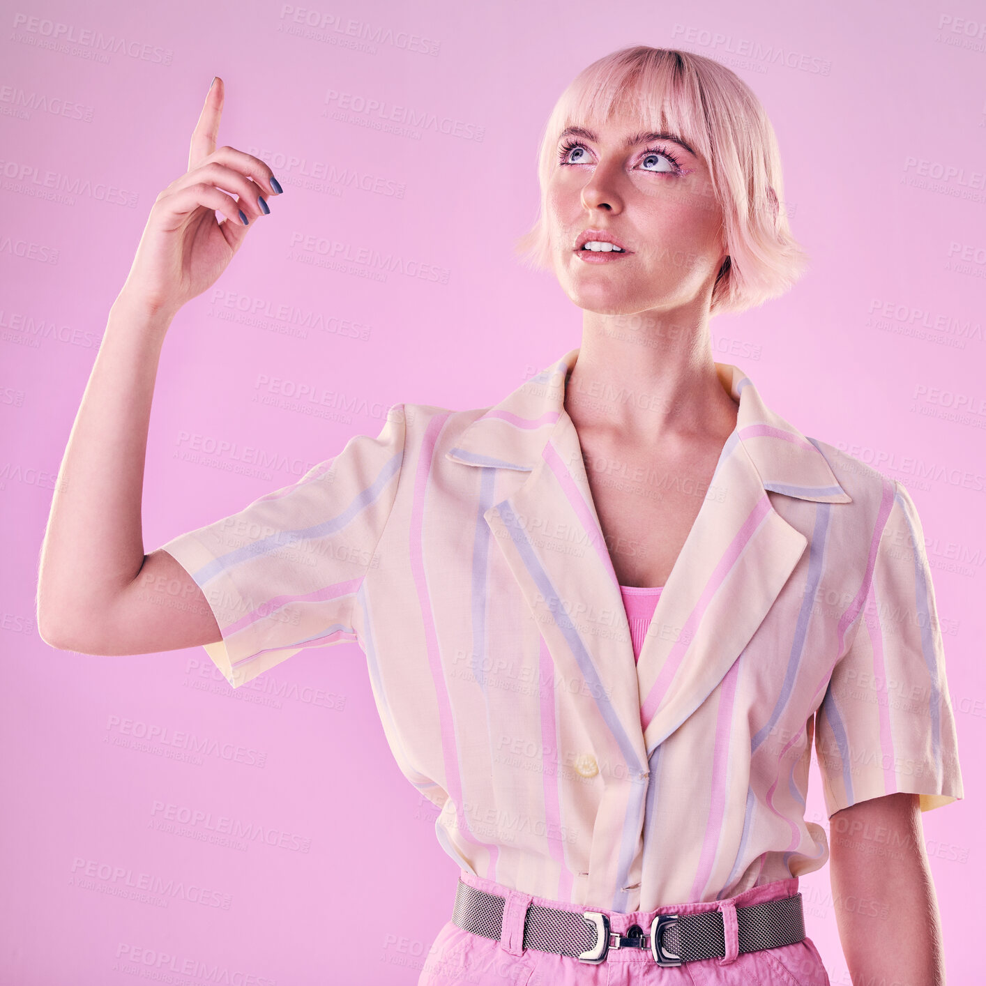 Buy stock photo Woman, mockup and pointing up to studio on pink background for advertising wall color. Female model, hands and press information on cyberpunk system, gen z fashion and user network backdrop space