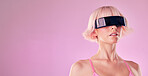 Glasses, virtual reality and a woman in metaverse for mockup future scifi and 3d gaming technology. Model person on a pink background for cyberpunk and digital transformation for ai cyber world vr ux