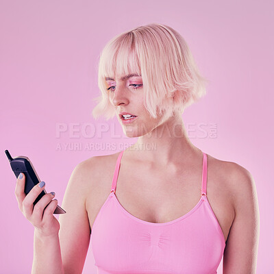 Buy stock photo Retro phone, fashion and woman with problem on pink background with network issue, glitch or spam. Creative aesthetic, beauty and confused girl with vintage cellphone, makeup and cosmetics in studio