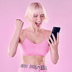 Winner, fashion and woman with phone on pink background for success, winning and online competition. Smartphone, beauty and excited, happy and girl cheering for bonus, discount deal and promotion