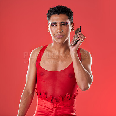 Buy stock photo Man, studio and bored for phone call, chat and tired of listening with gay aesthetic, fashion and red background. Young gen z model, lgbtq and retro communication with annoyed face, makeup and beauty