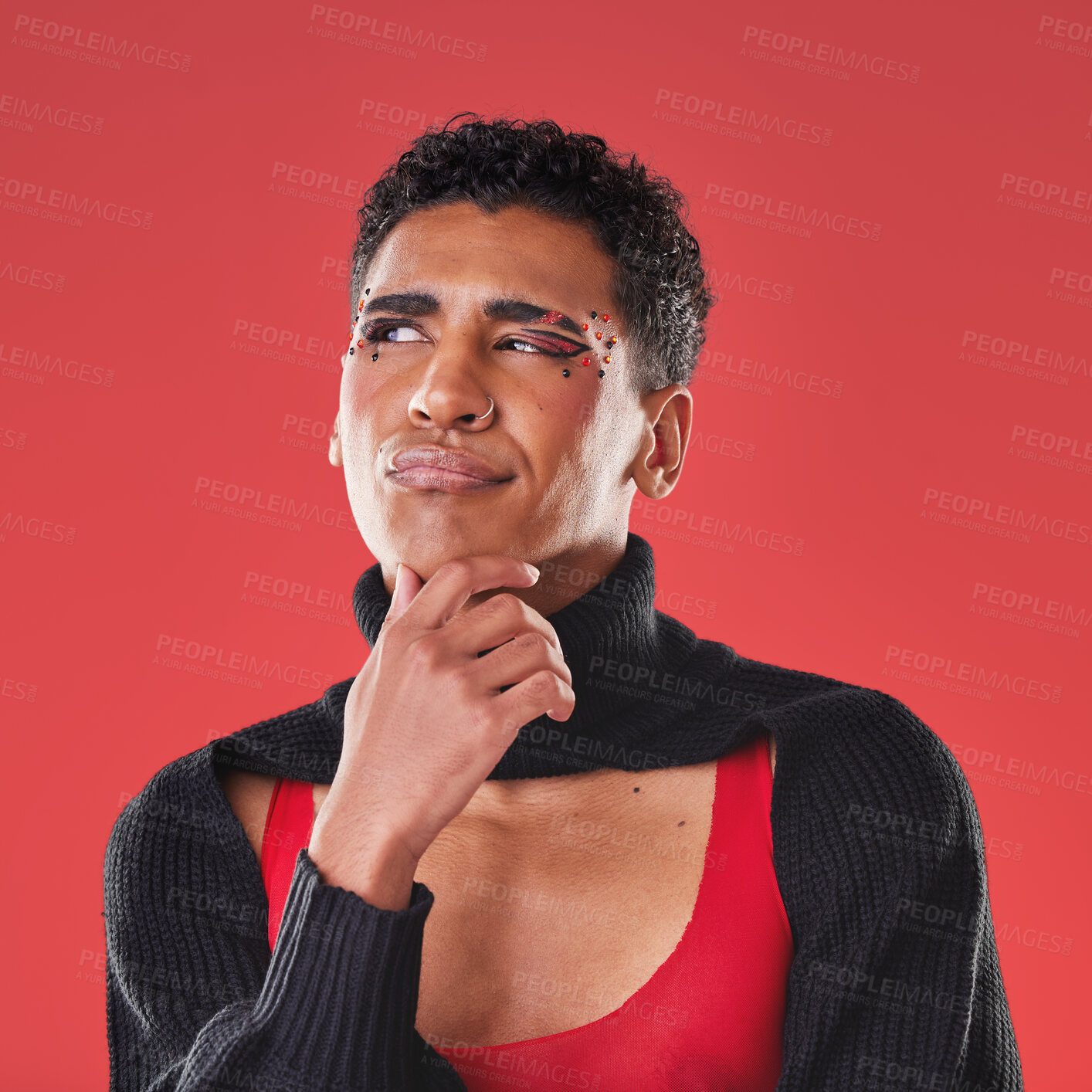 Buy stock photo Fashion, makeup and gay man thinking isolated on a red background in a studio. Idea, trendy and face of an lgbt person looking thoughtful, contemplative and pensive while fashionable on a backdrop