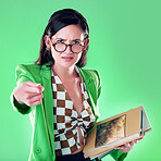 Angry, pointing and books with portrait of woman and teaching for study, learning and education. Mad, wrong and problem with annoyed teacher in green background studio for strict, failure and wrong 