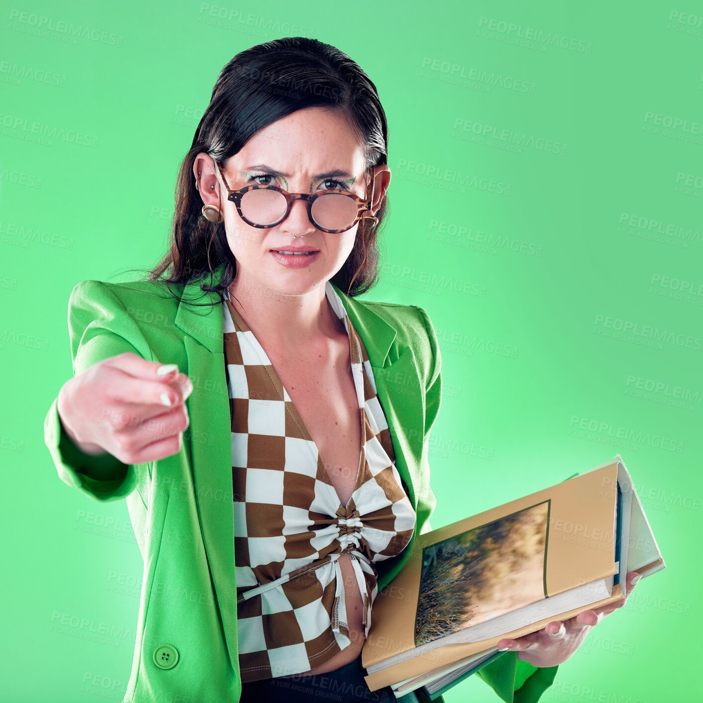 Buy stock photo Angry, pointing and books with portrait of woman and teaching for study, learning and education. Mad, review and problem with annoyed teacher in green background studio for strict, failure and wrong 