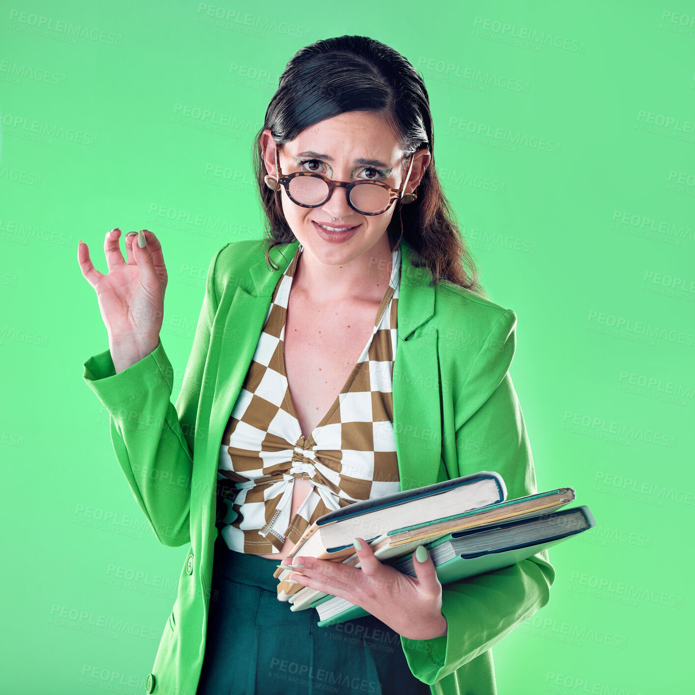 Buy stock photo Confused, elegant and portrait of a woman with books isolated on a green background in a studio. Classy, education and girl doing college research, studying and reading while frustrated on a backdrop