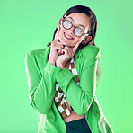 Woman, teacher and fingers on face with green screen, studio background or happy smile for career vision. Young model, education and ideas with glasses, mockup and with fashion, pride and happiness