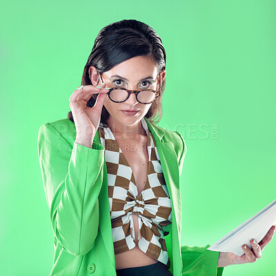 Buy stock photo Fashion, teacher and portrait of a woman in studio with glasses and paperwork to read. Style, trendy and female educator or model with stylish, cool and edgy outfit and spectacles by green background