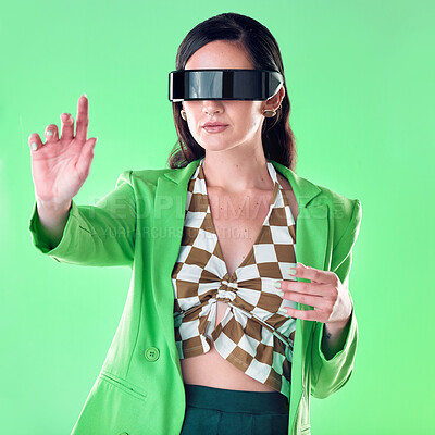 Buy stock photo Woman, vr and glasses in studio with hand by green background, gaming or web design for iot. Gen z model, education or idea for virtual reality coding, creative or fashion for ui, focus or metaverse