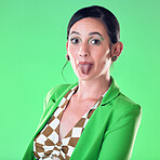 Portrait, fashion and woman with tongue out in studio isolated on a green background. Comic face, funny and gen z female model with makeup, cosmetics or beauty aesthetics, trendy or stylish suit.