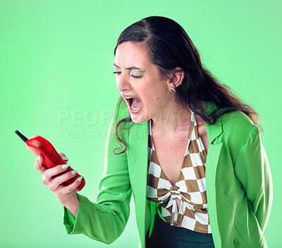 Buy stock photo Fashion, retro phone and woman angry shouting on green background with cosmetics, makeup and beauty. Aesthetic, vintage tech and upset girl scream at telephone spam, network problem or call decline