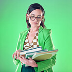 Woman, teacher and books with reading in studio, green screen or background with thinking for career vision. Young model, education and ideas with glasses, mockup and with fashion, ideas and focus