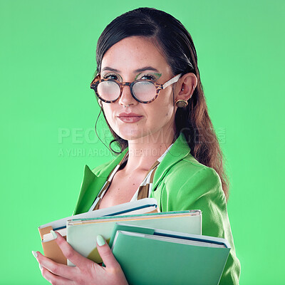 Buy stock photo Beauty, books and portrait of a woman in studio with glasses for teaching or education. Fashion, serious and female teacher with spectacles carrying textbooks for class isolated by green background.