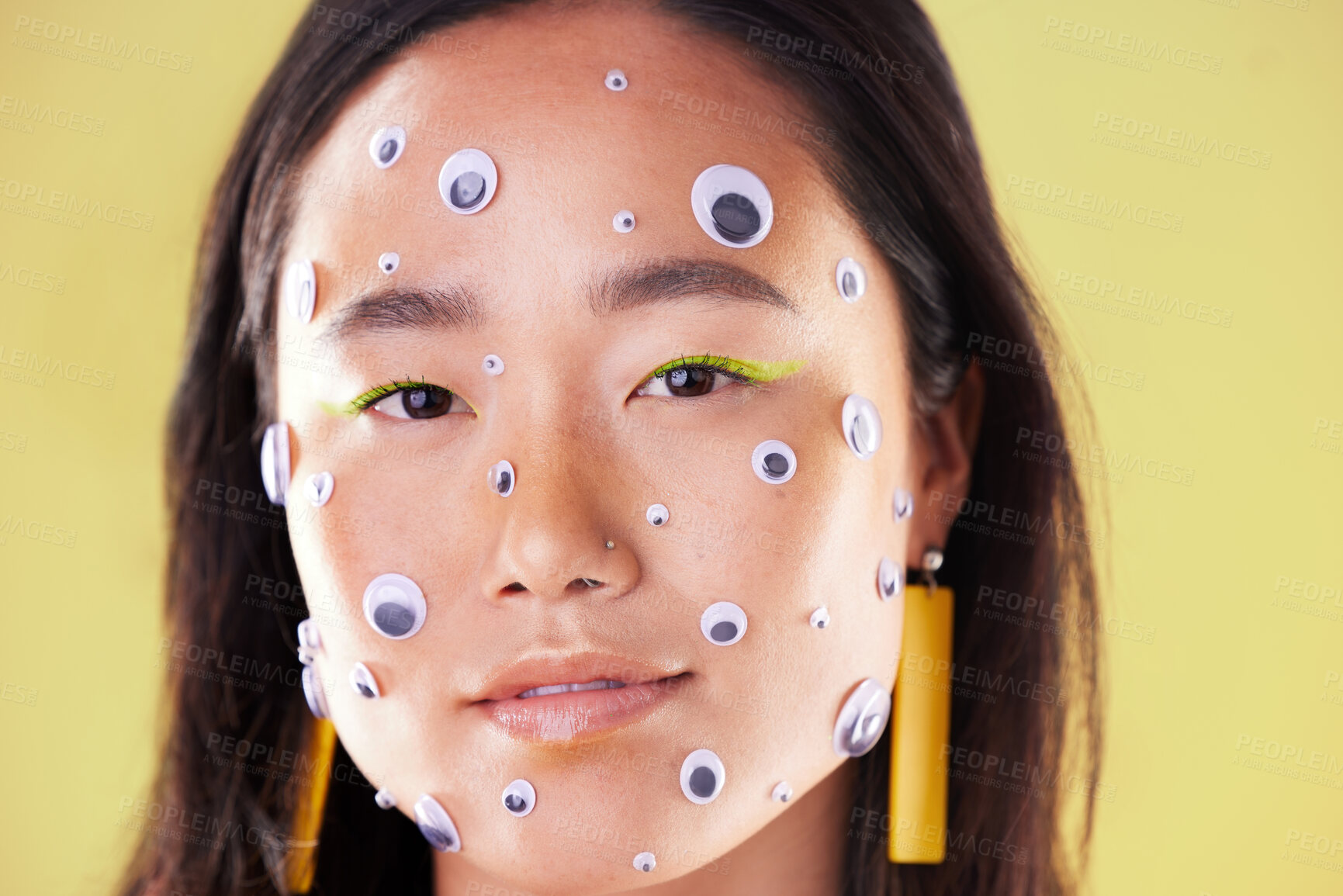 Buy stock photo Woman, face and portrait with eyes, cosmetics and makeup on a yellow background. Headshot of an aesthetic gen z model or asian girl in studio for trendy style, color and facial art creativity