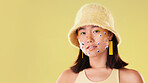 Fashion, portrait and Asian woman with comic eyes isolated on a yellow background in a studio. Face of aesthetic girl with mockup space for advertising and motivation for gen z cosmetics and beauty