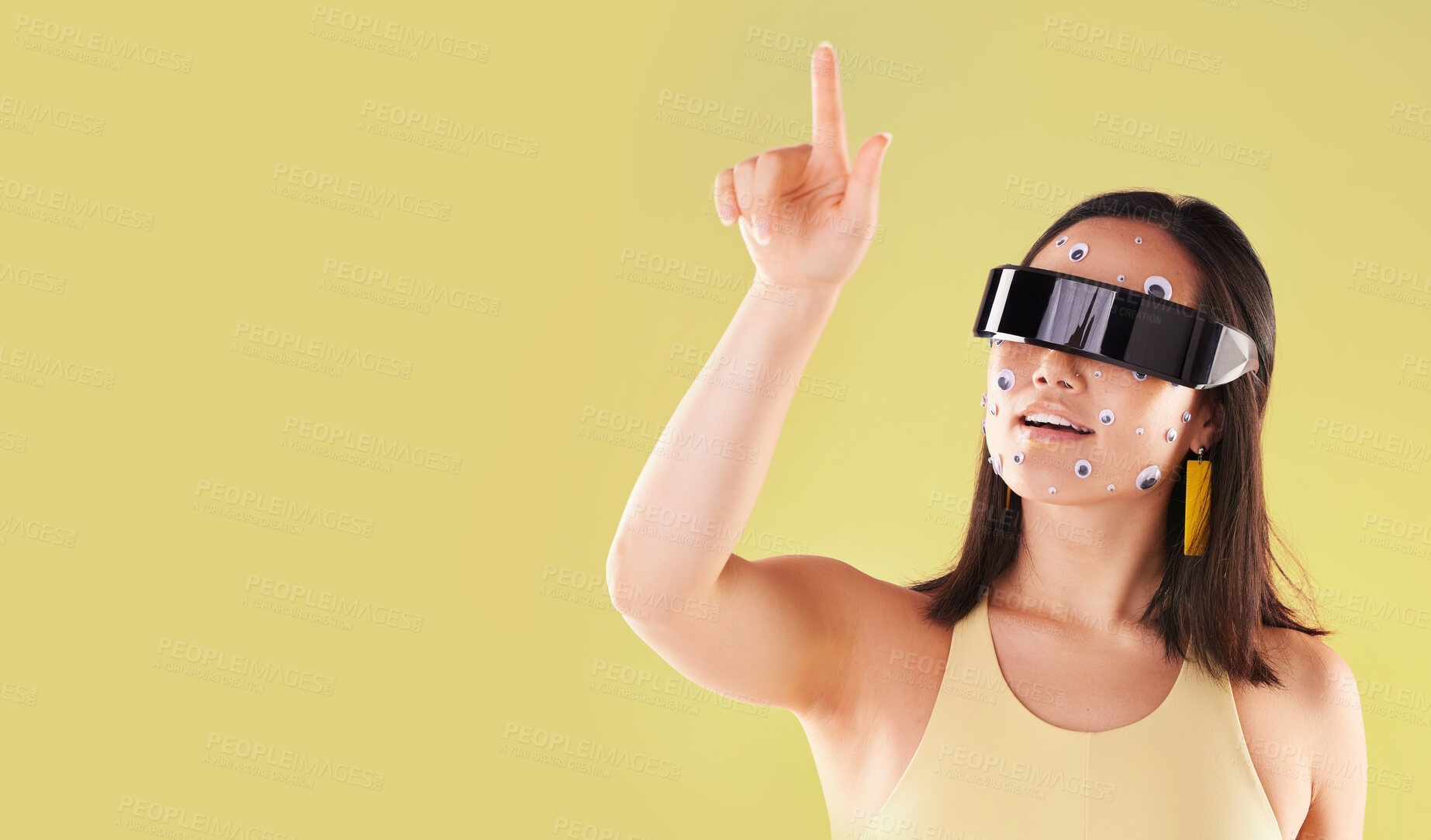 Buy stock photo Virtual reality, 3d metaverse and woman in vr, click in cyber world or futuristic tech. Mockup, face stickers and happy female with digital headset for gaming in studio isolated on yellow background.