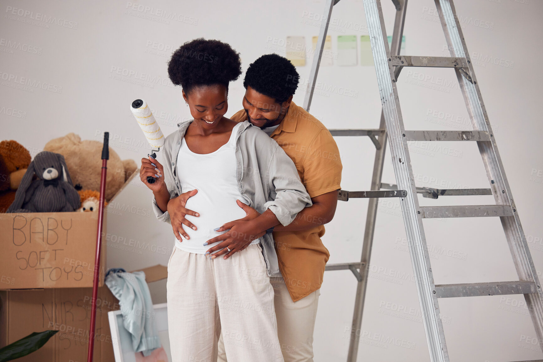 Buy stock photo Love, pregnancy or happy couple hugging in home renovation, diy or house remodel together by apartment ladder. African people, painting or black man with pregnant woman excited about baby or family 