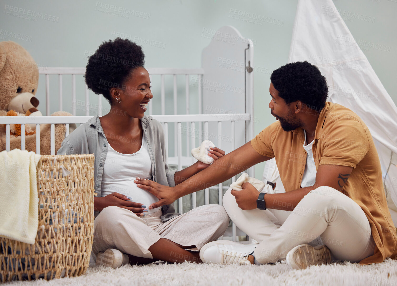 Buy stock photo Love, pregnant and black couple in bedroom, excited and celebration on floor, happiness and conversation. Pregnancy, man and woman with smile, stomach and family in home, wow and talking in house