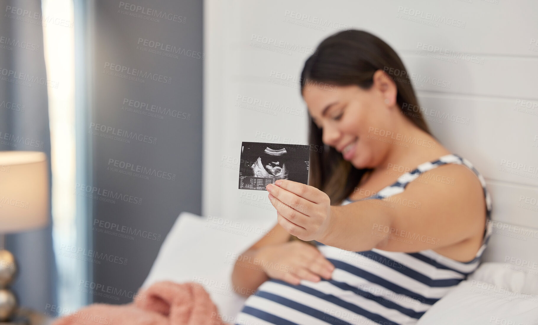 Buy stock photo Pregnant, woman and ultrasound in hand for baby development or growth. Happy person show baby scan photograph for gynecology, pregnancy update and health or wellness with sonogram in home bedroom