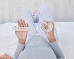 Pregnant, medicine and water in woman hands above pills box for health, growth and wellness. Person in home bedroom with a glass and Pharma product container for pregnancy supplement and development