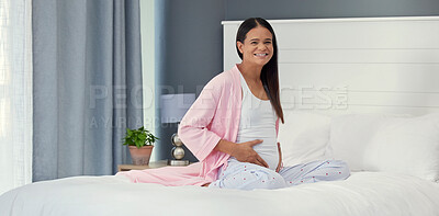 Buy stock photo Relax, happy and portrait of a pregnant woman on a bed for peace, rest and touching stomach. Smile, baby and girl feeling her belly during a pregnancy, maternity leave and break in the bedroom