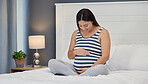 Pregnant, bed and mother with hands on abdomen holding stomach for baby, infant and child affection at home. Pregnancy love, family and excited, loving and happy woman rest, relax and calm in bedroom