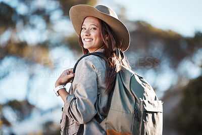 Buy stock photo Hiking, portrait and woman in nature for freedom, travel and backpacking adventure on blurred background. Face, girl and traveler walking in a forest, smile and excited for journey, vacation or trip