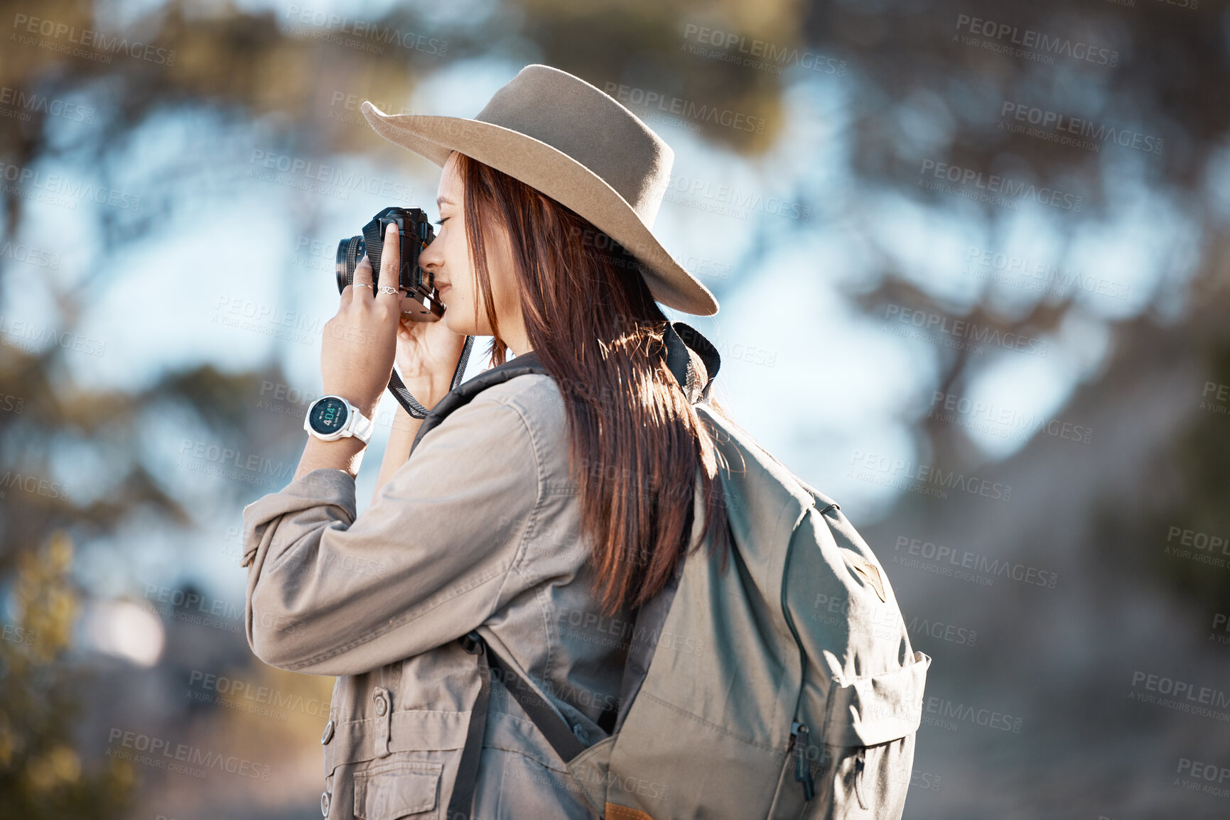 Buy stock photo Woman, tourist and photography in hiking, adventure or backpacking journey for sightseeing in nature. Female hiker taking photo with camera for travel memory or mountain trekking to explore scenery