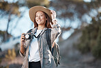 Woman, tourist and photographer with camera in hiking, adventure or backpacking journey for sightseeing in nature. Female hiker in travel photography for memory or explore mountain trekking scenery