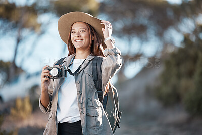 Buy stock photo Woman, tourist and photographer with camera in hiking, adventure or backpacking journey for sightseeing in nature. Female hiker in travel photography for memory or explore mountain trekking scenery
