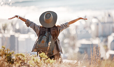 Buy stock photo Woman, tourist and hiking or travel freedom in city for adventure, backpacking or journey on mountain in nature. Female hiker with open arms enjoying fresh air, trekking or scenery of an urban town