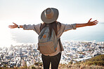 Woman, tourist and hiking or travel in city for freedom, adventure or backpacking journey on mountain in nature. Female hiker with open arms enjoying fresh air break, trekking or scenery of Cape Town