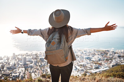 Buy stock photo Woman, tourist and hiking or travel in city for freedom, adventure or backpacking journey on mountain in nature. Female hiker with open arms enjoying fresh air break, trekking or scenery of Cape Town