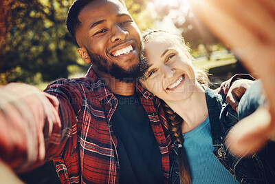 Buy stock photo Diversity couple, love selfie and portrait outdoors, having fun and bonding together in nature. Comic smile, interracial romance and black man and woman take pictures for happy memory or social media